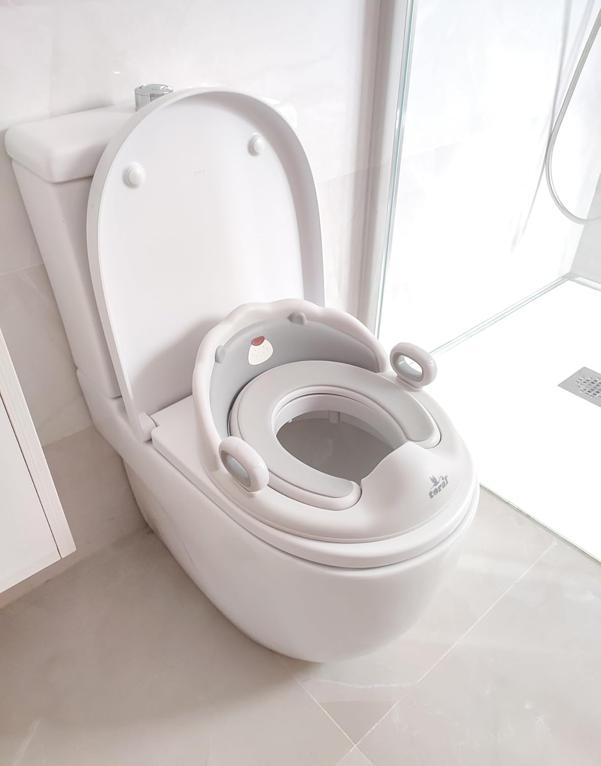 Imagen del producto - Toral Asiento Reductor con Asas para WC. Ayuda al aprendizaje de bebés y niños. Adaptador infantil portátil para váter MundiBebé +18 meses. Modelo Confort Osito